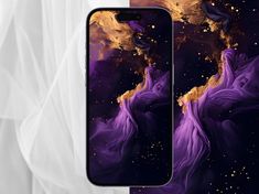 two iphones with purple and gold designs on them, one is open to the camera