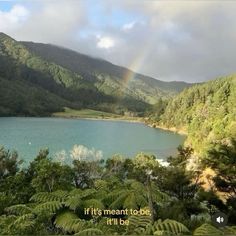 there is a rainbow in the sky above some trees and water with a quote on it