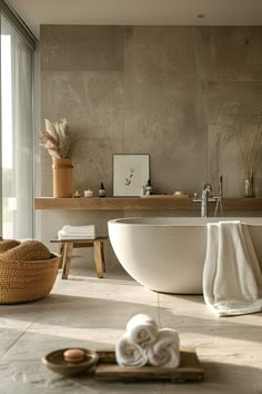 a bath room with a large tub and a sink