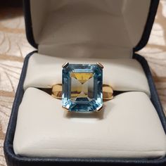 10k Yellow Gold Emerald Cut Blue Topaz Ring Concave Side Band Opened Gallery For Light Size 8 Beautiful Ring Smoke And Pet Free Home Sapphire Topaz Ring With Accent Stones For Formal Events, Sapphire Topaz Ring For Formal Occasions, Fine Jewelry Blue Topaz Ring For Formal Occasions, Blue Topaz Ring For Formal Occasions, Formal Blue Topaz Ring With Prong Setting, Formal Blue Topaz Ring With Accent Stones, Formal Sapphire Topaz Ring With High Clarity, Formal Blue Topaz Diamond Ring, Emerald Cut Blue Sapphire Ring With 17 Jewels