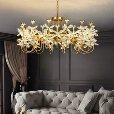 a living room with a couch and chandelier