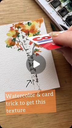 someone is painting flowers with watercolor and card trick to get this texture on the paper