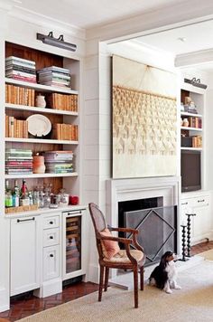 a living room filled with furniture and a fire place