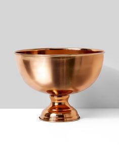 a large metal bowl sitting on top of a table