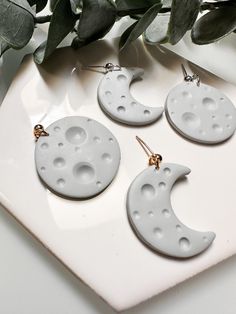 Detailed moon earrings. Each pair comes with one full moon and one crescent moon. Lightweight earrings, you'll forget you even have them on! White Handmade Moon-shaped Earrings, Moon-shaped White Earrings For Gift, White Moon-shaped Earrings As Gift, White Moon-shaped Earrings For Gifts, White Round Moon Phase Earrings, White Moon-shaped Earrings For Pierced Ears, White Crescent Earrings As Gift, White Crescent Earrings For Gift, White Crescent Earrings For A Gift