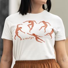 🖤FIND MORE TREASURES at MetisArtPrints * Explore our t-shirt collection! https://etsy.me/4bJMLv4 * Explore unique artworks! https://etsy.me/2Rw7KcO 🖤ABOUT Celebrate Matisse's iconic 'Dance' with this vibrant and artistic t-shirt! This soft cotton, short-sleeved t-shirt is the perfect gift for art teachers, enthusiasts, or anyone who appreciates artistic clothing. 💯 HAPPINESS GUARANTEE * Your happiness is our priority. * If you have any issues with your order, let us know--we'll fix it! * We o Tshirt Artwork, Artistic Clothing, Unique Artworks, Art Teacher Gifts, Semi Formal Wear, Artist Shirts, Artist Outfit, The Dance, Art Teacher