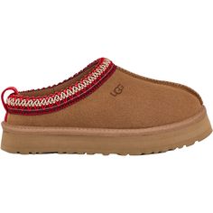 The UGG Tazz for kids is the perfect clog you've been searching for. With a platform outsole for a trendy lift and a sturdy step-in feel, it’s both stylish and practical. The ultra-soft UGGplush lining and insole provide dreamy, moisture-wicking comfort for little feet. The playful UGGbraid detail adds a unique touch only UGG can offer. Match their style with the adult version for a fun mini-me moment. If they love the Tasman, they'll definitely adore the Tazz. These UGG Taz Chestnut Suede Kids' Tasmanian Uggs, Ugh Tasman, Uggs Tazz, Tazz Ugg, Tan Uggs, Ugg Tazz Slippers, Tasman Uggs, Tazz Slippers, Cute Uggs