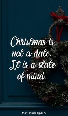 a christmas wreath with the words, christmas is not a date it's a state of mind