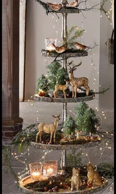 three tiered trays with christmas decorations and deer figurines