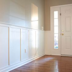 an empty room with hard wood floors and white paint on the walls is pictured in this image