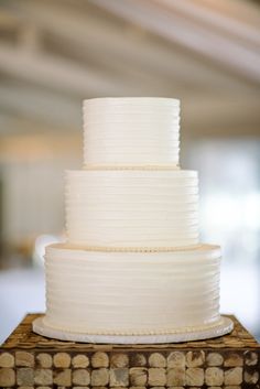 a white cake sitting on top of a wooden table