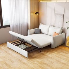 a white couch sitting on top of a hard wood floor