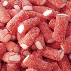 a pile of red and white candies sitting on top of each other