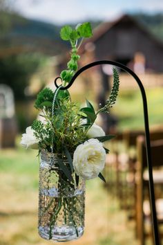 a vase filled with flowers sitting on top of a table