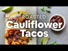 roasted cauliflower tacos on a cutting board with limes and salsa in the background