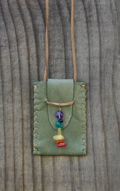 This one of a kind Handmade Magical Medicine bag is made from recycled leather and hand stitched by me. It hangs from a faux leather cord that is approximate 14" long.  I have added a moon, earth, and sun cleansed single quartz crystal the "master healer" to each bag, leaving plenty of room for you to ad your own small special stones. Quartz Crystals are said to amplify energy by absorbing, storing, releasing, and regulating it.  These magic necklace bags make an amazing gift for ourselves and/or our loved ones.  MODELS PHOTOS WITH BAGS ARE ONLY EXAMPLES Fabric Pouch Necklace, Medicine Bags Native American, Handmade Bags For Daily Use, Ffa Projects, Medicine Bag Necklace, Indian Bags, Leather Medicine Pouch, Fabric Brooches, Magic Necklace