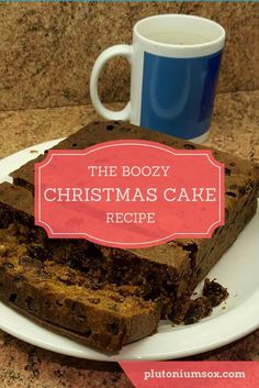 the boozy christmas cake recipe on a plate with a cup of coffee in the background