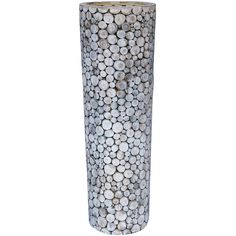 a white vase with circles on it