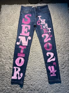 ig: deonaanyree Graduation Pants, Senior Jeans Ideas High Schools, Homecoming Pants, Senior Year Planning, Graduation Things, Senior Sweatshirts