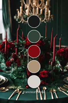 the table is set with candles, plates and flowers in shades of red, green, white and gold