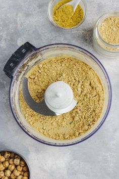 a food processor filled with ingredients to make chickpeas