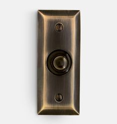 an antique brass light switch with two knobs on the front and back sides, viewed from above