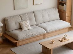 a living room with a couch, coffee table and bookshelf