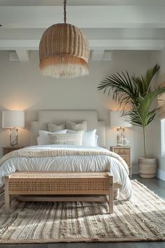 a bedroom with a large bed and wicker furniture