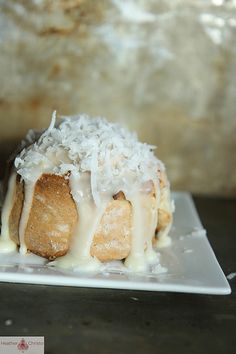 a pastry with coconut toppings on a white plate