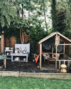 an outdoor kitchen in the middle of a garden