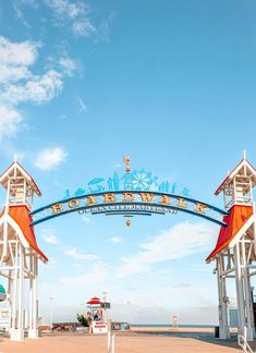 the entrance to an amusement park on a sunny day