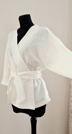 "White kimono blouse * long sleeves  * belt decorated with four  * loose blouse SIZE CHART: SIZE XS (mostly USA/CA-2, UK-4, AU/NZ-6, JAP-5, EU-32) Bust/Waist/Hips 80cm/60cm/88cm 31.5\"/25.2\"/34.5\" SIZE XS/S (mostly USA/CA-4, UK-6, AU/NZ-8, JAP-7, EU-34) Bust/Waist/Hips 84cm/64 cm/92cm 33\"/26.5\"/36.2\" SIZE S (mostly USA/CA-6, UK-8, AU/NZ-10, JAP-9, EU-36) Bust/Waist/Hips 88cm/68cm/96cm 34.5\"/28.5\"/37.7\" SIZE M (mostly USA/CA-8, UK-10, AU/NZ-12, JAP-11, EU-38) Bust/Waist/Hips 92cm/72cm/100cm 36.2\"/30\"/39.5\" SIZE L (mostly USA/CA-10, UK-12, AU/NZ-14, JAP-13, EU-40) Bust/Waist/Hips 96cm/76cm/104cm 37.7\"/31.5\"/41\" SIZE L/XL (mostly USA/CA-12, UK-14, AU/NZ-16, JAP-15, EU-42) Bust/Waist/Hips 100cm/80cm/108cm 39.5\"/33\"/42.5\" SIZE XL (mostly USA/CA-14, UK-16, AU/NZ-18, JAP-17, EU-4 Blouse Size Chart, Kimono Style Tops, Kimono Shirt, Kimono Blouse, White Blouse Top, White Kimono, Angel Outfit, Linen White, Style Blouse