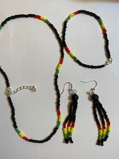 Rasta style choker necklace with extender chain. Measures approx 15 inches not including extender chain bracelet approximately 7 inches dangle earring approximately 2 inches Handcrafted in South Wales UK Free postage and packing in the UK Rasta Jewelry, Matching Bracelets, Chain Bracelet, Seed Beads, Choker Necklace, Bracelet, Dangle Earrings, Jewelry Necklaces, Chain