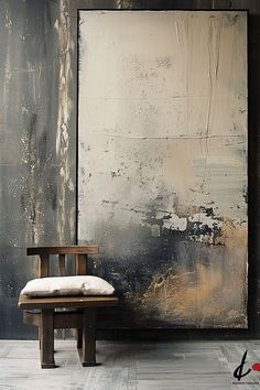 a chair sitting in front of a large painting on the wall next to a wooden bench