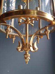 a golden chandelier hanging from the ceiling