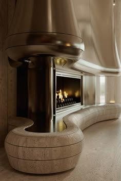 a modern fireplace in the middle of a room