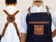 two men wearing denim suspenders with leather straps that say sada not york on them