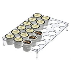 six cups of ice cream on a clear tray with two rows of cupcakes