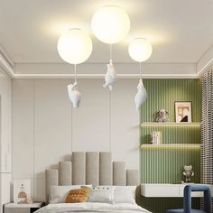 a bed room with a neatly made bed and two lamps hanging above the headboard