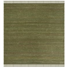 a green rug with fringes on the bottom and an area rug in the middle