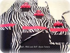 three zebra print bags with pink bows on them