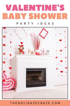 a valentine's baby shower party with hearts hanging from the ceiling and decorations on the fireplace