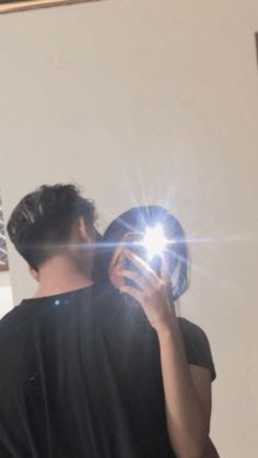 a man taking a selfie in front of a mirror