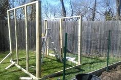 a backyard area with a fenced in chicken coop