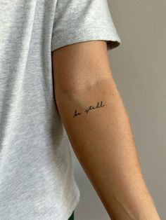 a person with a small tattoo on their arm