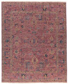 an antique rug with red and blue colors