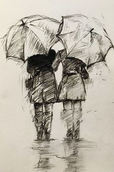 two people with umbrellas standing in the rain