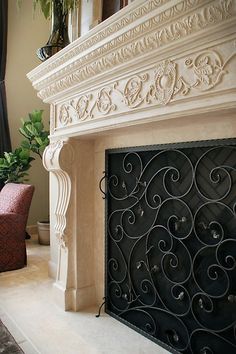 a living room with a fire place next to a couch and chair in front of a window