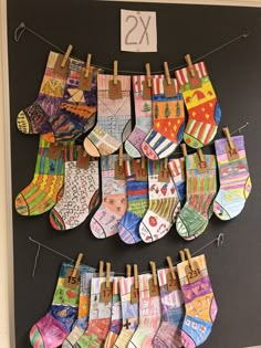 there are many pairs of socks hanging on the clothesline with numbers twenty and twenty