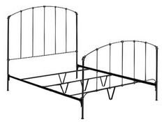 a metal bed frame with curved posts